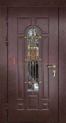Темная железная дверь со стеклом и ковкой для частного дома ДСК-156 в Хотьково