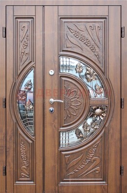 Уличная дверь в цвете Итальянский орех с виноритом и ковкой со стеклом ДВТ-147 в Хотьково